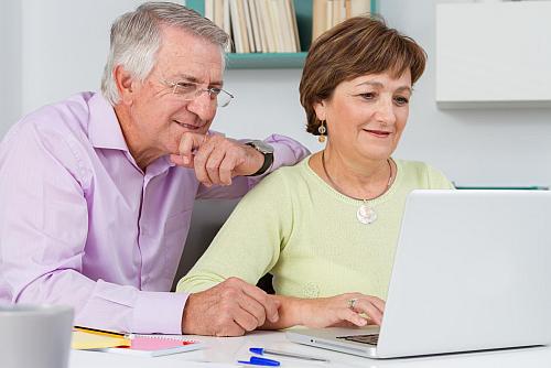 Couple looking at laptop